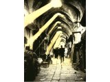 Jerusalem. The arcaded bazaars and dark narrow alleys are like those in which our Lord walked. An early photograph.